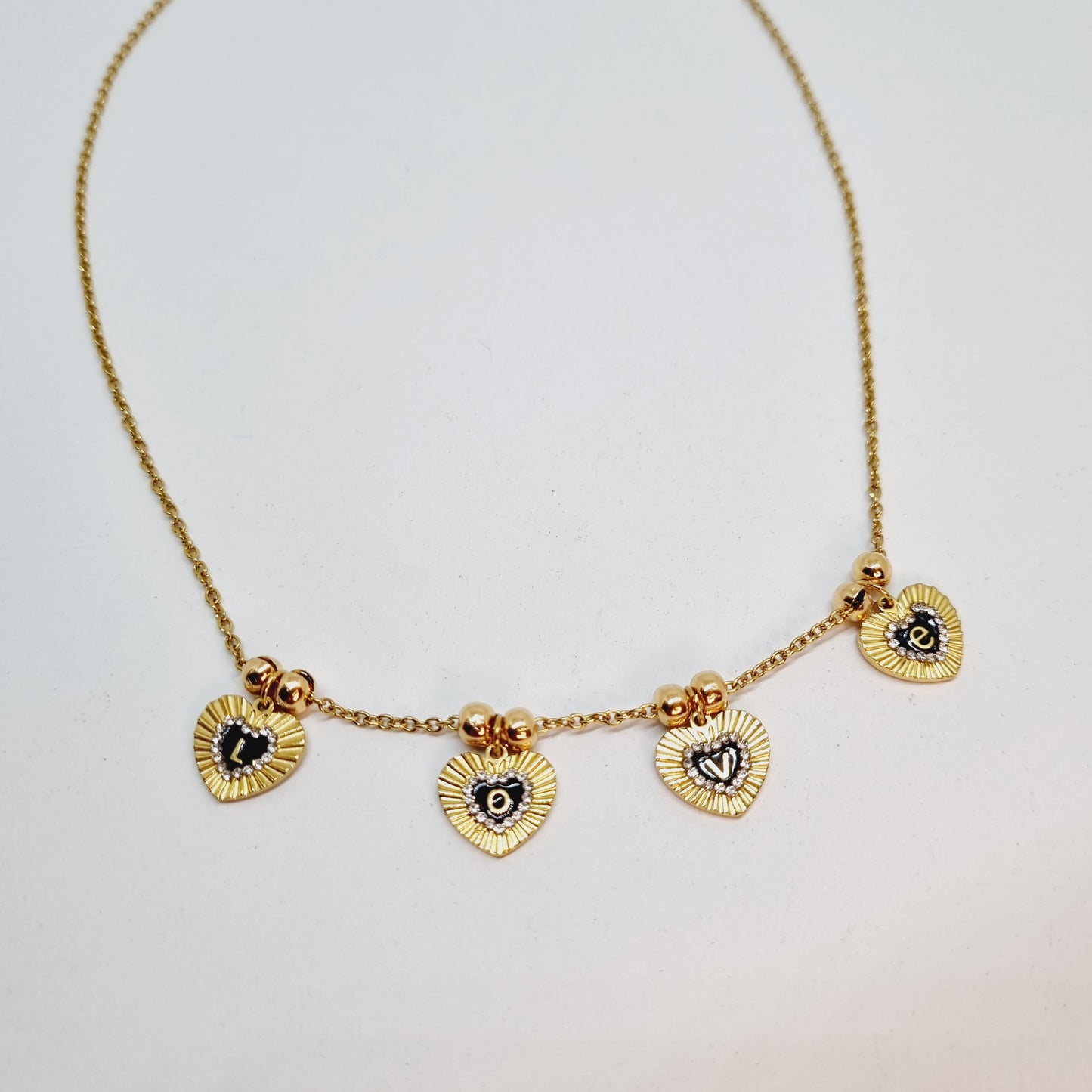 Collier chaîne acier doré message L.O.V.E.