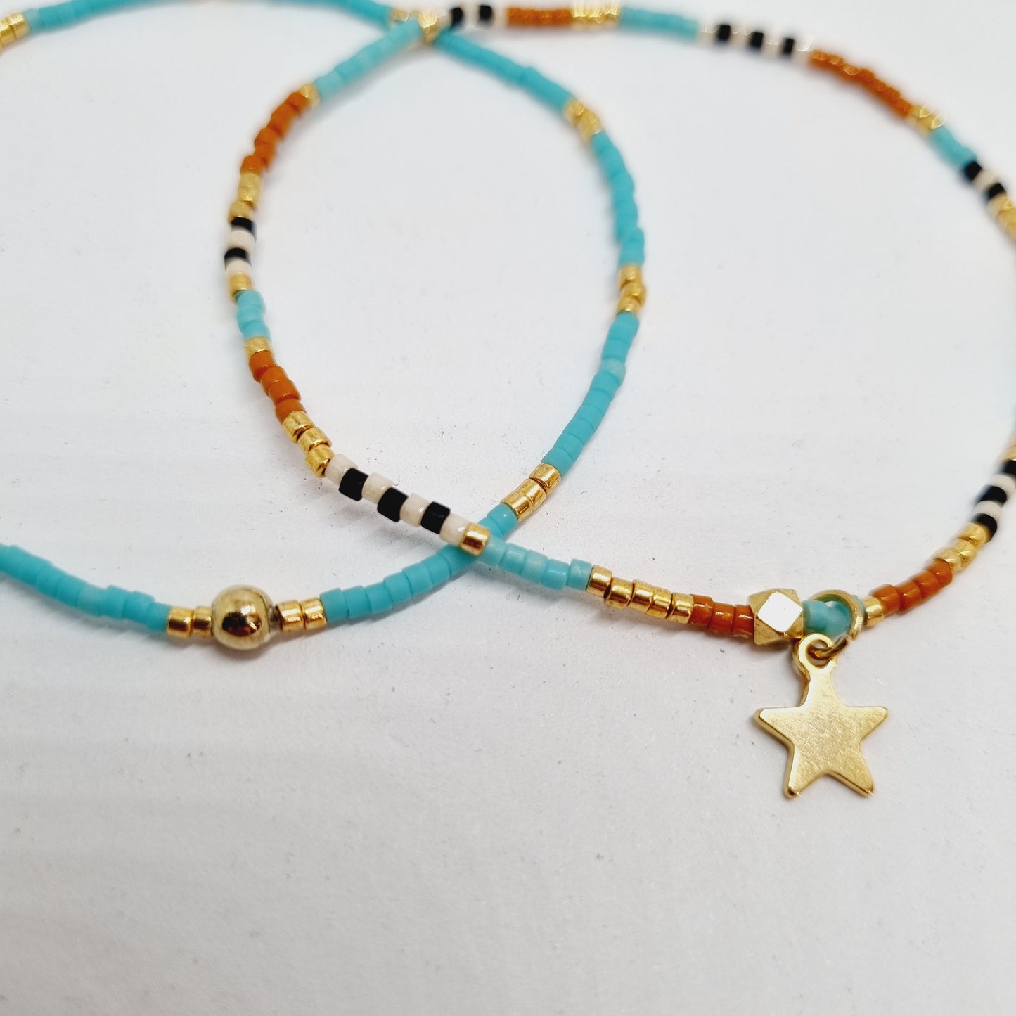 Bracelet double perles fines et étoile acier doré COSMOS