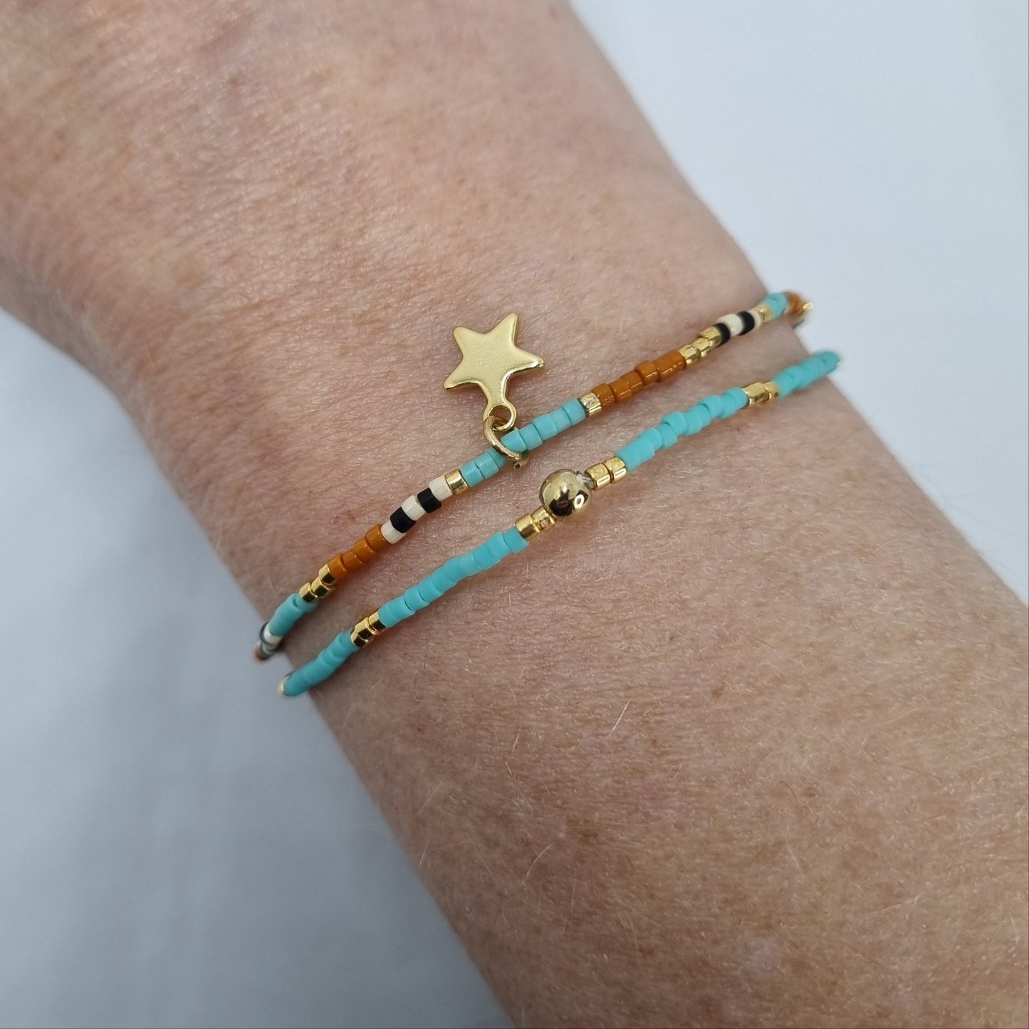 Bracelet double perles fines et étoile acier doré COSMOS